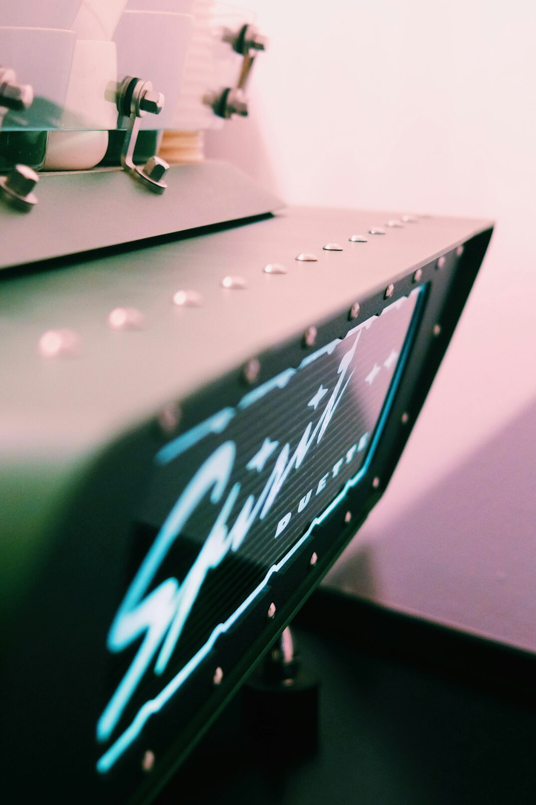 Close up of a video switcher desk with a bank of preview monitors